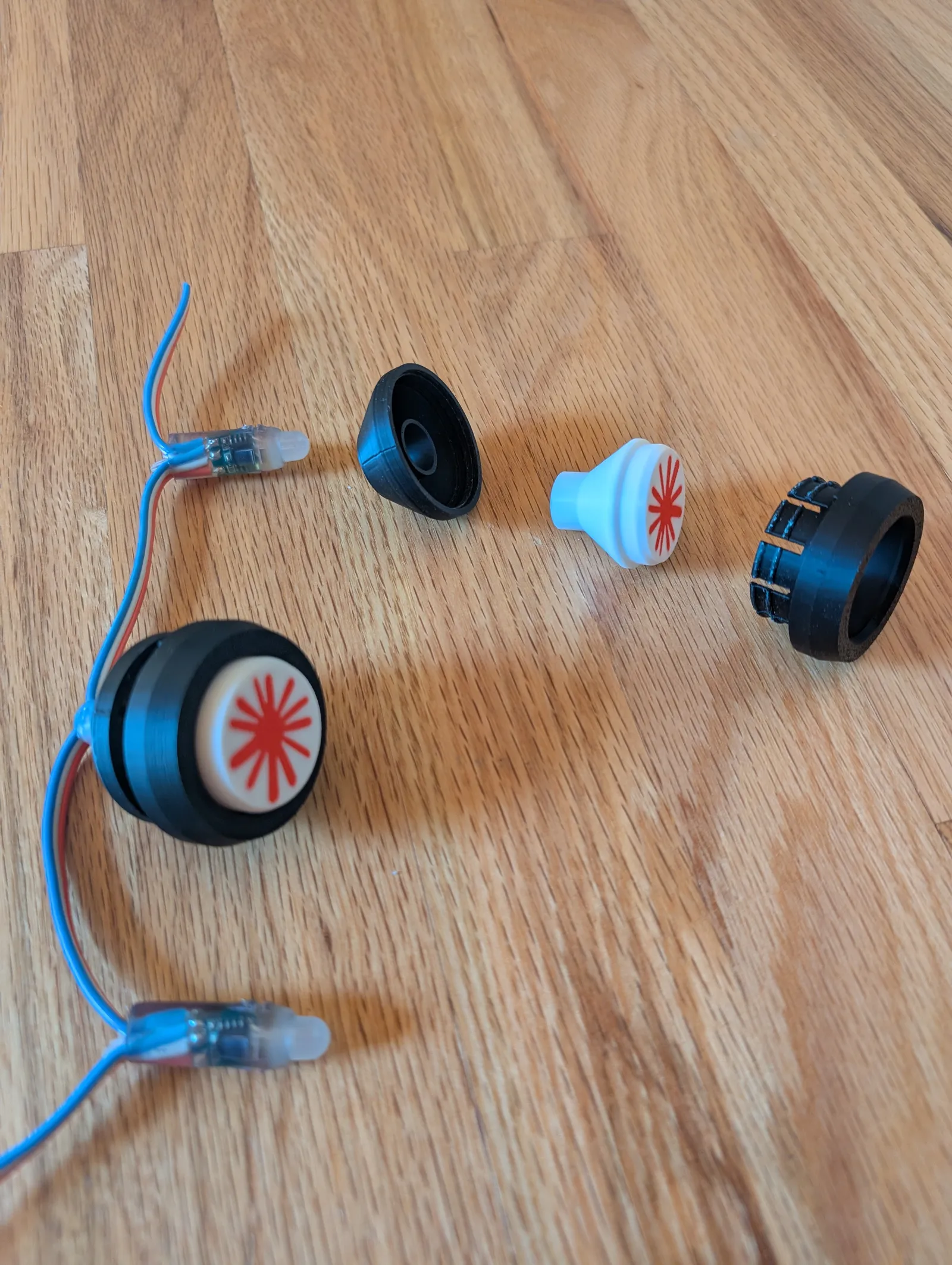 Exploded view of the 3D-printed LED button housings