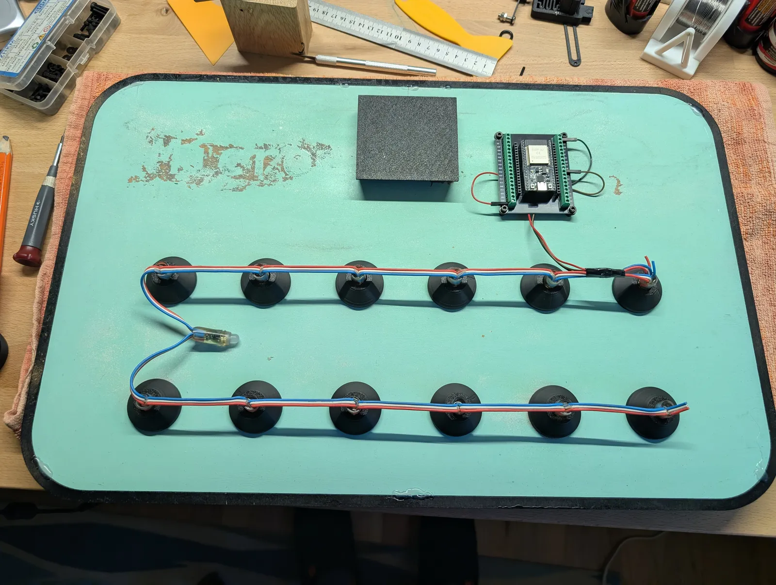 Back of the board showing wired WS2812B LEDs and the ESP32 controller